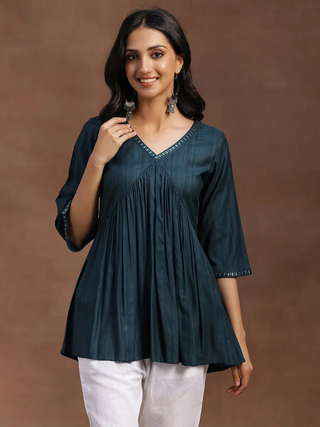 29147.Main_75fc7ad0-7a3c-45e7-b01f-45baa50c165a.webp Green Solid Rayon A-line Kurti - Image 1